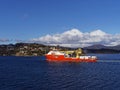 The Normand Ocean Offshore Supply Vessel in Bergen Fjord, heading out fully loaded with Oil and Gas Equipment Royalty Free Stock Photo