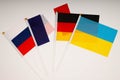 Normandy four meeting. Normandy format summit. Flags of Ukraine, Russia, Germany, France on white background. War in Donbas.