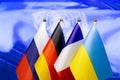 Normandy four meeting. Normandy format summit. Flags of Ukraine, Russia, Germany, France on blue background. War in east Ukraine