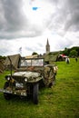 Normandy, France; 4 June 2014: Image of an American army jeep in Normandy in a camp. Recreation on the 70th anniversary