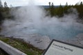 YELLOWSTONE NATIONAL PARK, WYOMING - JUNE 7, 2017: Steam Rolls Off Emerald Spring in the Back Basin Area of Norris Geyser Basin Royalty Free Stock Photo