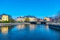 NORRKOPING, SWEDEN, APRIL 23, 2019: People are strolling at riverside of Motala strom river in Norrkoping, Sweden