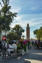 Morocco. Marrakesh. Carriages for tourists with the Koutoubia minaret in the background