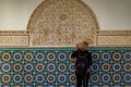 Morocco. Marrakesh. Madrasa Ben Youssef. The largest and most important madrassah in Morocco. A woman tourist look at the koranic Royalty Free Stock Photo