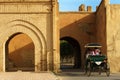 Morocco. Taroudant. A horse-drawn carriage past the city walls