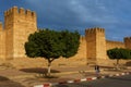 Morocco. Taroudant. A woman walking front of the city walls