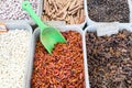 North African red and black spices in containers in a Paris, France market