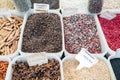 North African red and black spices in a Paris market with French signs