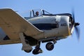 North American Aviation T-28D Trojan aircraft VH-CIA wearing Lao People`s Liberation Army Air Force markings takes off from Tyabb