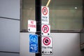 North American no parking signs and a roadsign indicating a bike lane abiding by North American standard in Toronto, Canada. Royalty Free Stock Photo