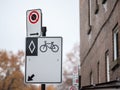 North American standard roadsign indicating a bike lane in Montreal, Quebec, Canada. Royalty Free Stock Photo