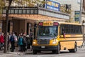 North American Yellow School Bus parked on a street, waiting for students to go out in a downtown area of Toronto, Ontario, Canada