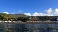 North of bali in amed mount seraya in the backgroundblack beach with black sand and local fishing boat