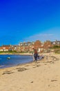 North Berwick beach and tourists walking on the sand, East Lothian