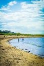 North Berwick beach and tourists walking on the sand, East Lothian