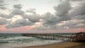 A North Carolina pier and beach at sunset Royalty Free Stock Photo