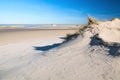 Beach walk o on the endless wide, sandy beach of  Norderney Island in February Royalty Free Stock Photo