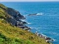 The north Devon coast near Woolacombe showing the steeply inclined slate strata of the Morte Slates Formation Royalty Free Stock Photo