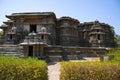 North entrance on the left, Facade and ornate wall panel relief of the North side, Hoysaleshwara Temple complex, Halebid, Karnatak