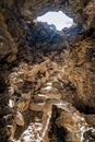 The north entrance to the Ovis Cave at the Lava Beds National Monument in California, USA