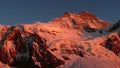 The north face of Jungfrau mountain peak in warm red evening light in the Swiss Alps above Grindelwald Royalty Free Stock Photo