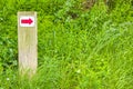 North German red arrow directional sign meadow forest nature Germany