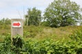 North German red arrow directional sign meadow forest nature Germany