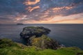 North Ireland Sea Coast Sunset, Cliffs and Rocks around Carrick-a-Rede Rope Bridge, North Ireland Royalty Free Stock Photo