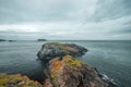 North Ireland Sea Coast Sunset, Cliffs and Rocks around Carrick-a-Rede Rope Bridge, North Ireland Royalty Free Stock Photo