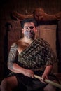 NORTH ISLAND, NEW ZEALAND- MAY 17, 2017: Close up of a Maori leader man with traditionally tatooed face in traditional Royalty Free Stock Photo