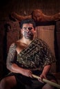NORTH ISLAND, NEW ZEALAND- MAY 17, 2017: Close up of a Maori leader man with traditionally tatooed face in traditional Royalty Free Stock Photo