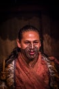 NORTH ISLAND, NEW ZEALAND- MAY 17, 2017: Close up of a Maori man with traditionally tatooed face and in traditional Royalty Free Stock Photo