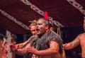 NORTH ISLAND, NEW ZEALAND- MAY 17, 2017: Close up of a Tamaki Maori leader man dancing with traditionally tatooed face Royalty Free Stock Photo