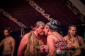 NORTH ISLAND, NEW ZEALAND- MAY 17, 2017: Tamaki Maori couple dancing with traditionally tatooed face in traditional