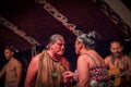 NORTH ISLAND, NEW ZEALAND- MAY 17, 2017: Tamaki Maori couple dancing with traditionally tatooed face in traditional Royalty Free Stock Photo