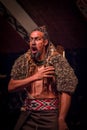 NORTH ISLAND, NEW ZEALAND- MAY 17, 2017: Tamaki Maori man screaming with traditionally tatooed face in traditional dress