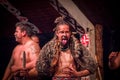 NORTH ISLAND, NEW ZEALAND- MAY 17, 2017: Tamaki Maori men one is sticking out tongue with traditionally tatooed face and