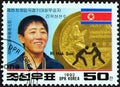 NORTH KOREA - CIRCA 1992: A stamp printed in North Korea shows Ri Hak Son freestyle wrestling, circa 1992.