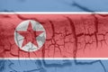 North Korea flag painted on grungy cracked wall