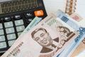 North Korea, money and calculator and notebook, Financial concept of North Korean currency and household budgets and economic