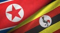 North Korea and Uganda two flags textile cloth, fabric texture