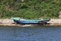 North korean fishing boat wreck on coastal rocks.