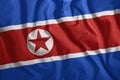 North Korean flag fluttering in the wind. Colorful, national flag of North Korea. Patriotism, a patriotic symbol