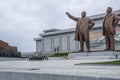 North Korean people bowing in front of Kim Il Sung and Kim Jong Il statues in Mansudae Grand Monument, Pyongyang Royalty Free Stock Photo