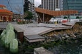 Modern North Kumutoto Pavilion with strips on folded plates and steel posts on coastal decked square, Wellington CBD, New Zealand