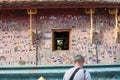 North Laos: Tourist visiting the Wat Xieng Thong temple in Luang Brabang City