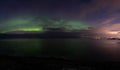 North lights Aurora Borealis seen from Atlantic Ocean road in winter night. Norwegian wintertime Royalty Free Stock Photo