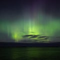 North lights Aurora Borealis seen from Atlantic Ocean road in winter night. Norwegian wintertime Royalty Free Stock Photo