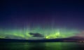 North lights Aurora Borealis seen from Atlantic Ocean road in winter night. Norwegian wintertime Royalty Free Stock Photo