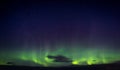 North lights Aurora Borealis seen from Atlantic Ocean road in winter night. Norwegian wintertime Royalty Free Stock Photo